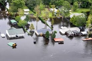 three houses in a flood
